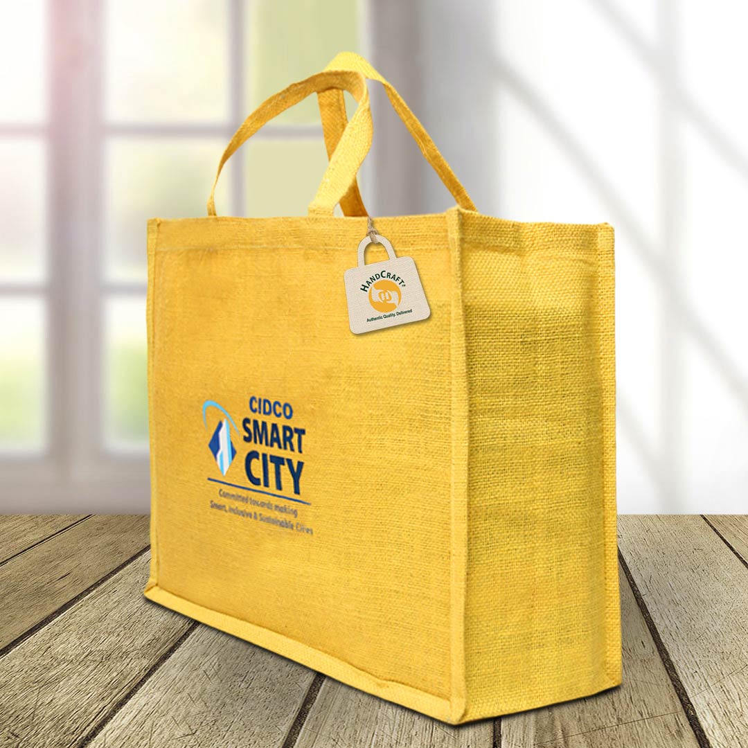 Yellow tote with flat handles and a dark printed logo.
