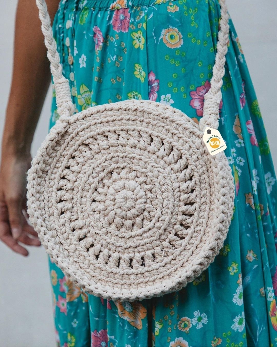 Round macrame shoulder bag shown being worn.