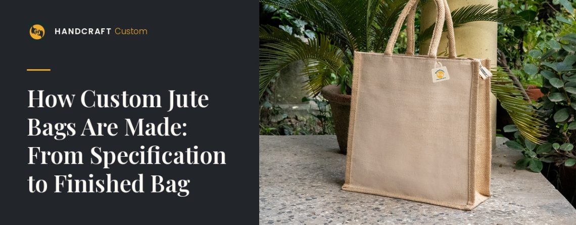 Plain natural-colour jute bag with padded rope handles and side gussets, standing on a stone ledge.