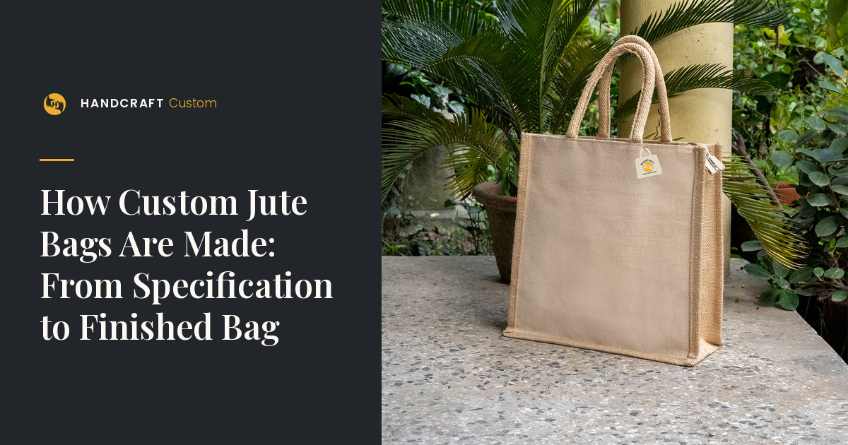 Plain natural-colour jute bag with padded rope handles and side gussets, standing on a stone ledge.