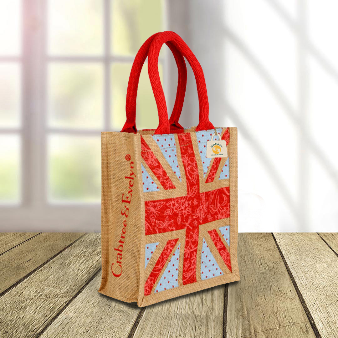 Union Jack printed bag with padded red handles.