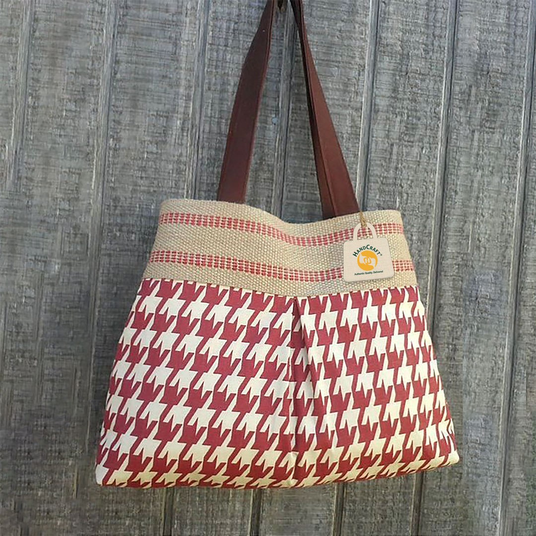 Shoulder bag with a red patterned front panel.