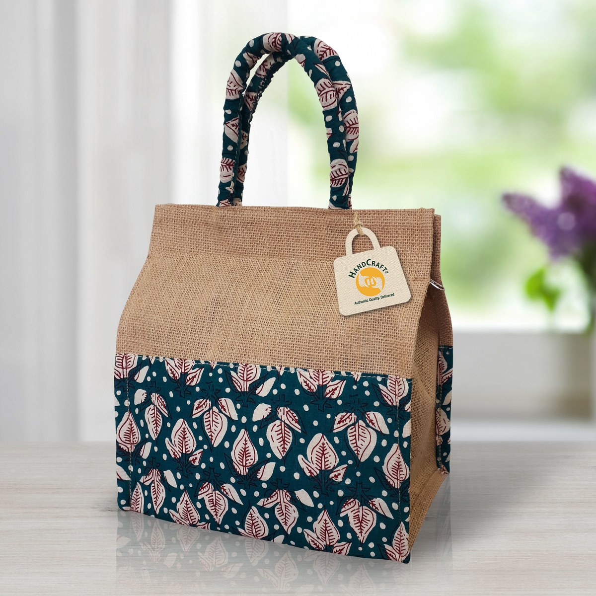 Bag with a patterned lower panel and matching handles.
