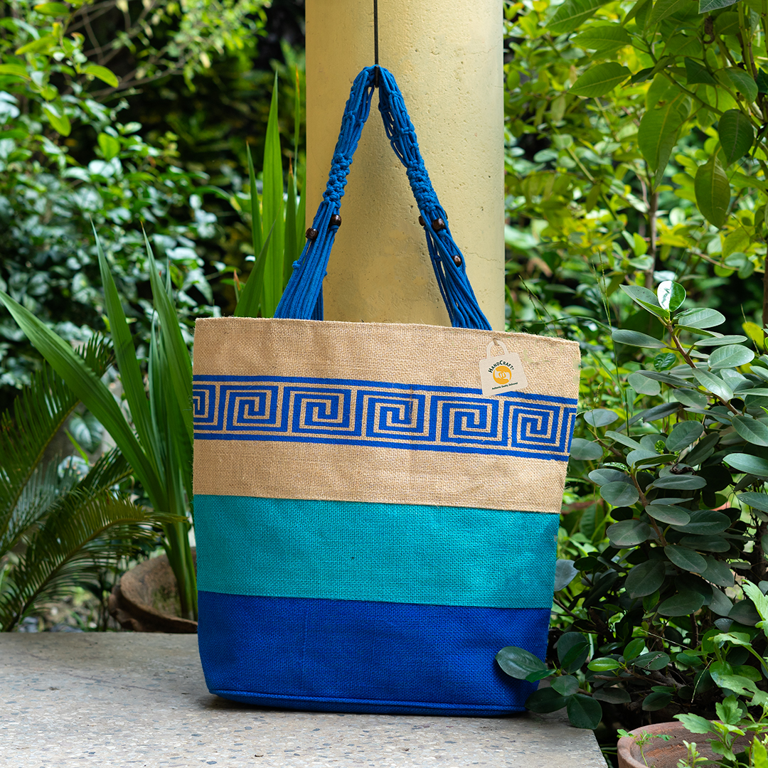 Blue tote with a pale geometric border design.